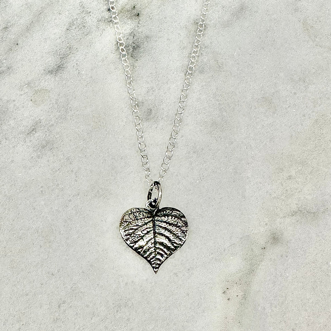 Close-up of the Sterling Silver Heart Leaf Necklace, showcasing the textured leaf design with delicate vein details.