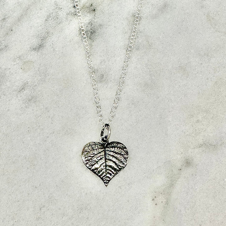 Close-up of the Sterling Silver Heart Leaf Necklace, showcasing the textured leaf design with delicate vein details.