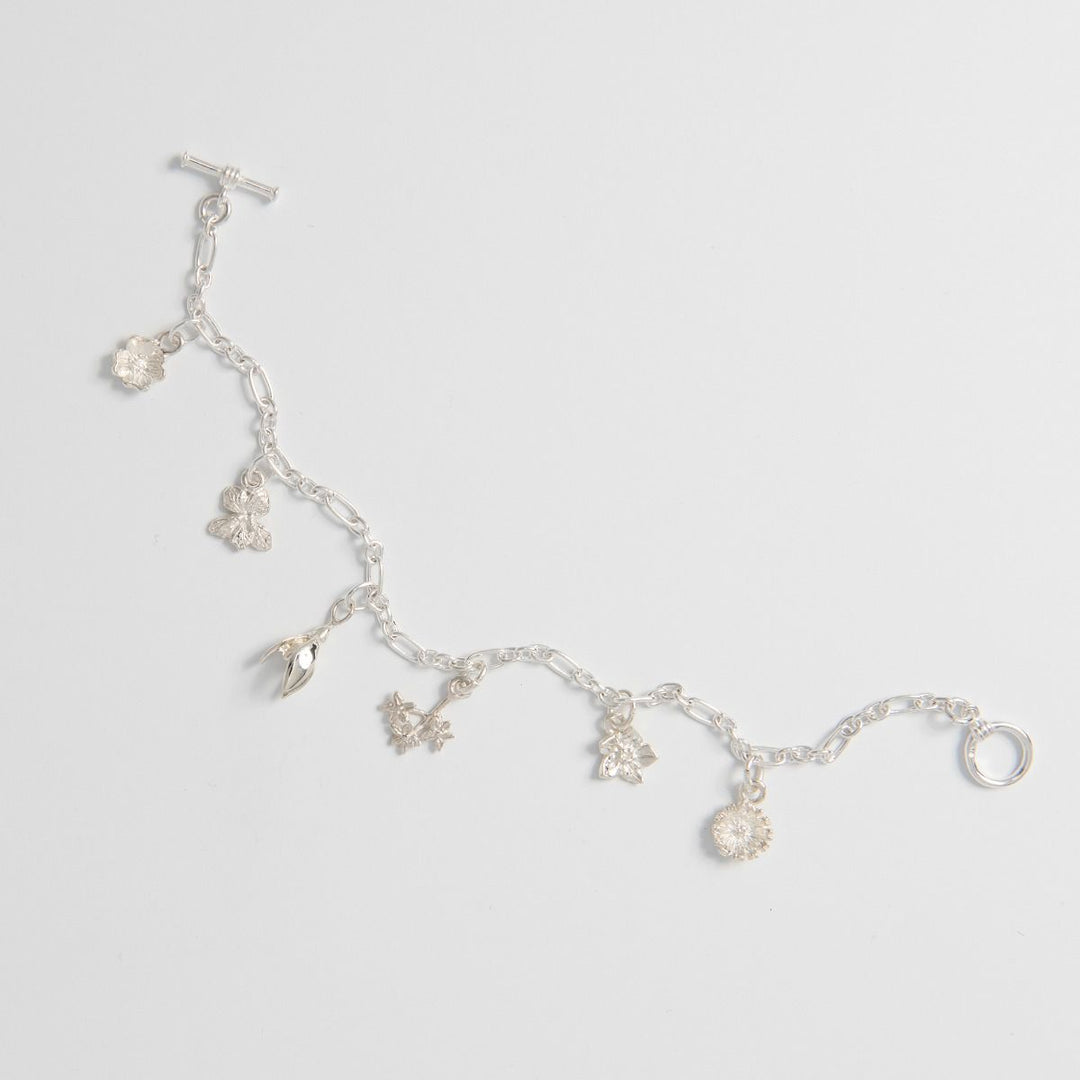 Close-up of Flower Charms – Handmade Silver Nature-Inspired Bracelet