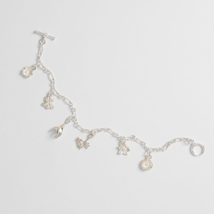 Close-up of Flower Charms – Handmade Silver Nature-Inspired Bracelet