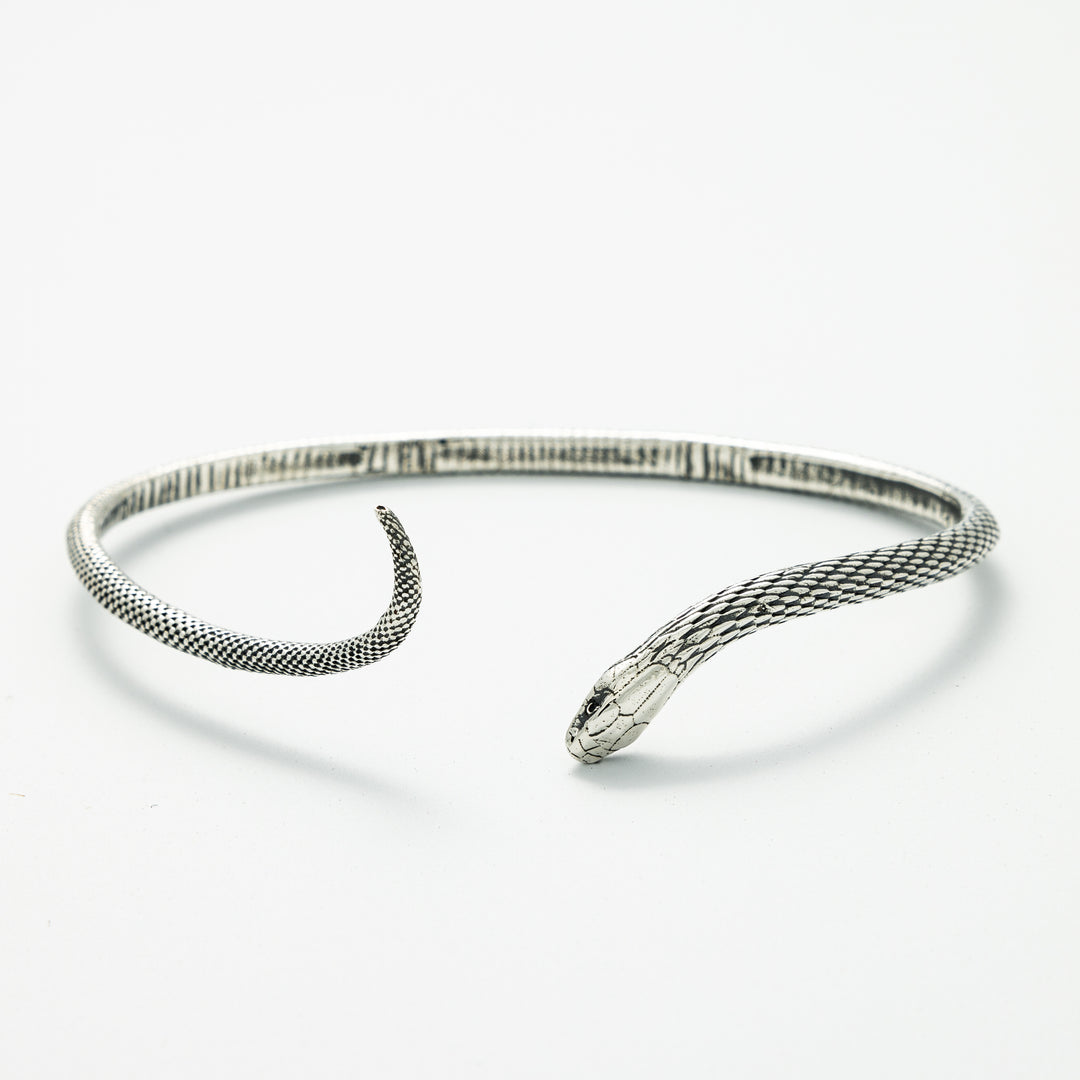 Close-up of Blackbird Jewellery Sterling Silver Snake Bracelet with textured design snakes head – Handmade in the UK