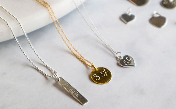 Gold and silver engraved charm necklaces with hand-stamped initials and names – Blackbird Jewellery
