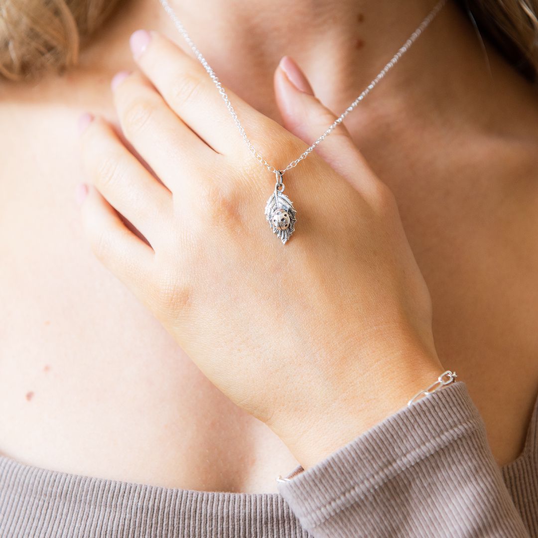 Model wearing sterling silver ladybird necklace – nostalgic handmade jewellery by Blackbird Jewellery