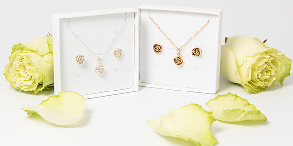 Blackbird Jewellery Bloom & Save collection – handmade sterling silver and gold vermeil flower necklace and earring bundles displayed in gift boxes with roses, offering 15–20% savings.