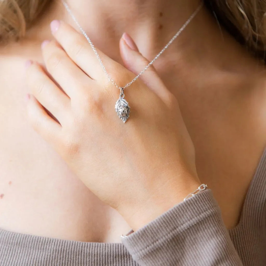 Woman wearing a handmade sterling silver pendant necklace from the Blackbird Jewellery Necklaces collection.
