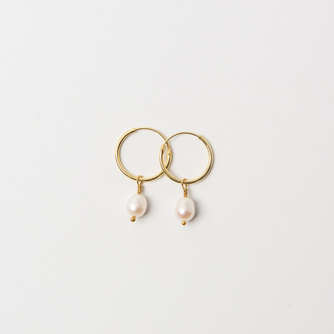 Gold hoop earrings handcrafted in the UK — featuring 18ct gold vermeil finishes and nature-inspired designs by Blackbird Jewellery