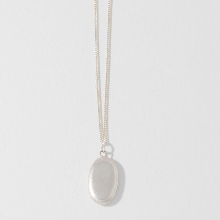 Blackbird Jewellery Sterling silver large pebble necklace cast from a real beach pebble, front view.