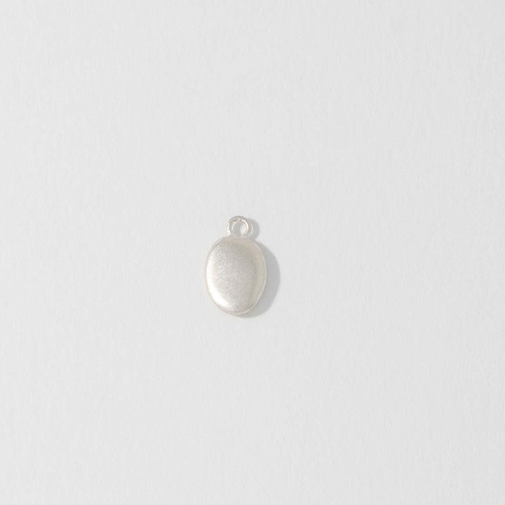 A small sterling silver pebble charm with a lobster clasp or jump ring on a white background.