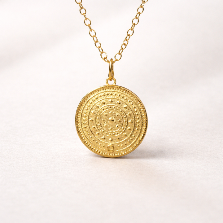 Close-up of gold vermeil horse pendant from Blackbird Jewellery Enchanted Animals collection