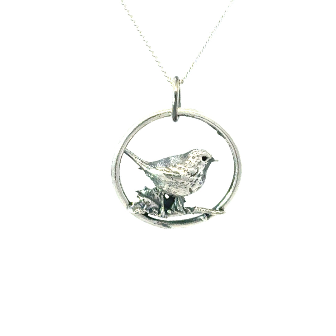 Blackbird Jewellery Close up of robin perched on holly within circular pendant – nature inspired sterling silver necklace