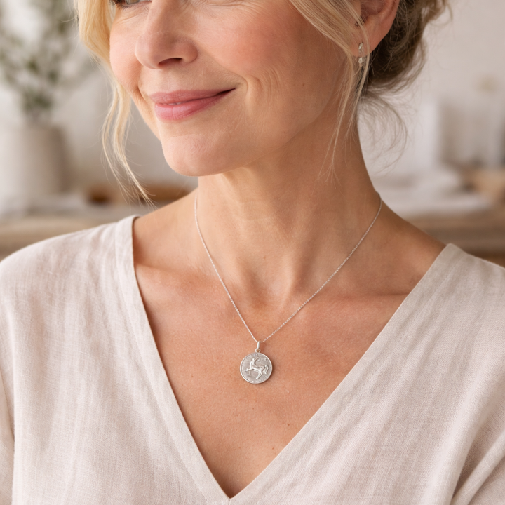 Model wearing sterling silver horse necklace by Blackbird Jewellery