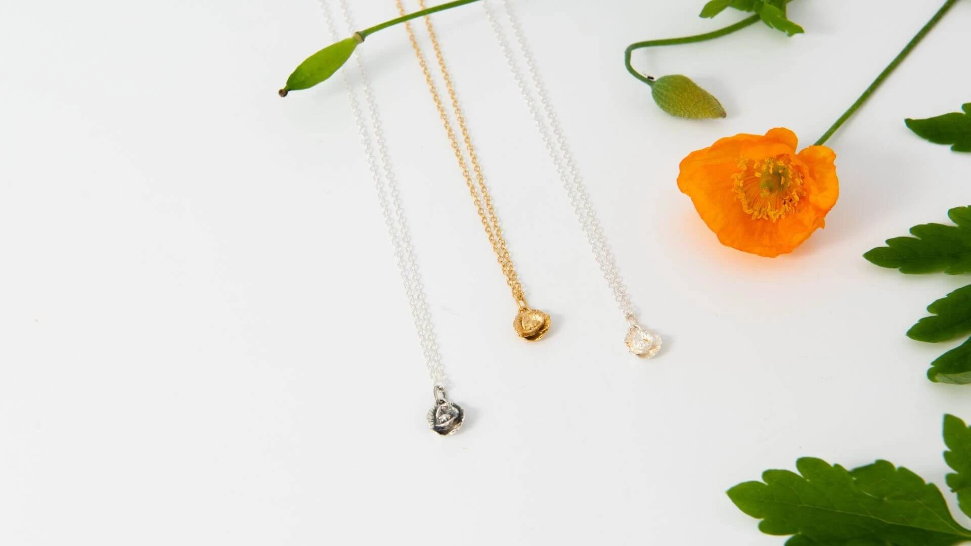 Blackbird Jewellery Poppy Necklace in sterling silver and gold vermeil with orange poppy flower — handmade birthflower jewellery gift.