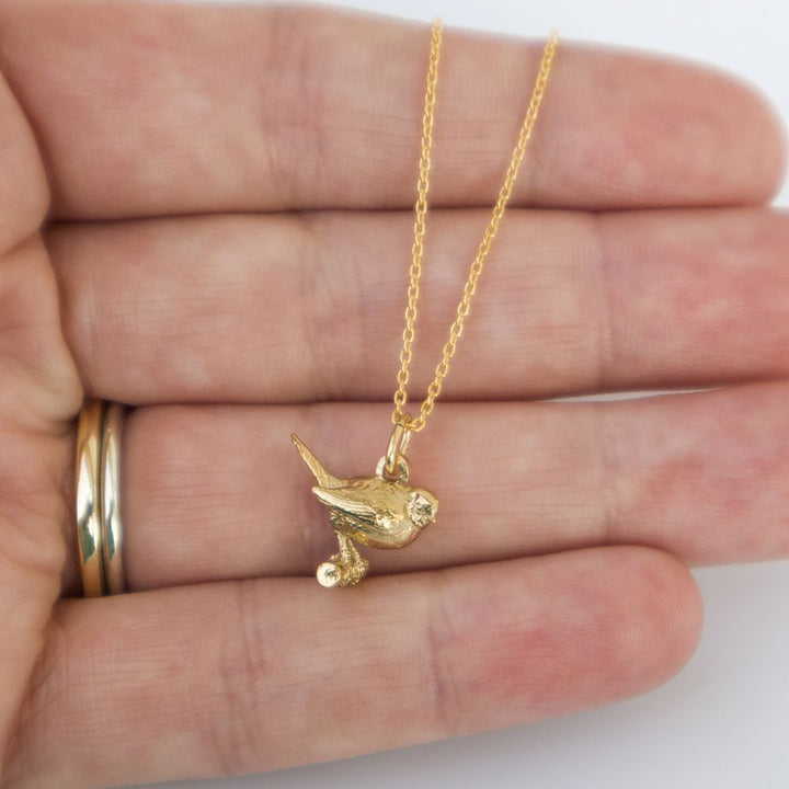 Blackbird Jewellery Close-up of gold robin pendant necklace 