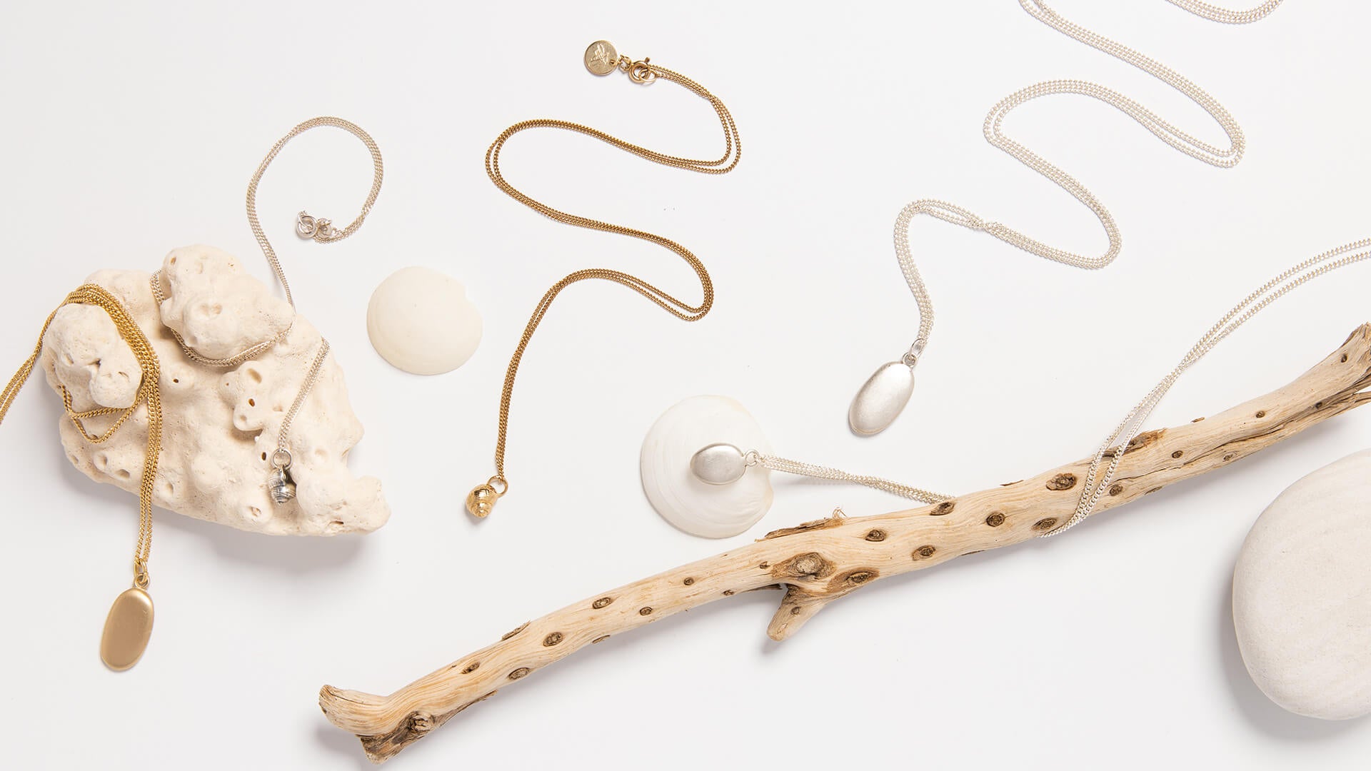 Sea-inspired jewellery with pebbles and winkles – coastal-themed handcrafted designs reflecting ocean treasures