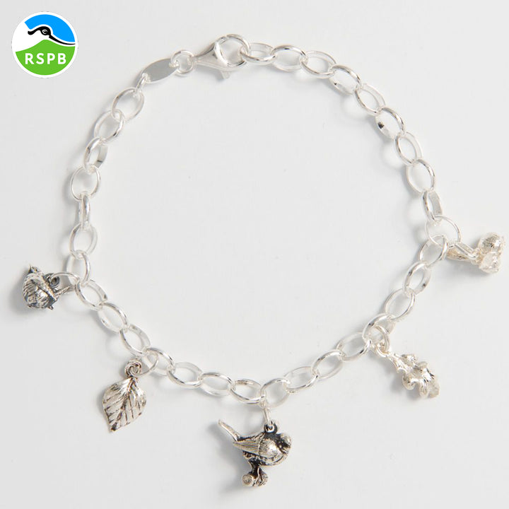 Blackbird Jewellery Sterling silver Woodland Whispers Charm Bracelet with five charms (wren, robin, bumblebee, birch leaf, oak leaf), handmade in the UK and supporting RSPB.