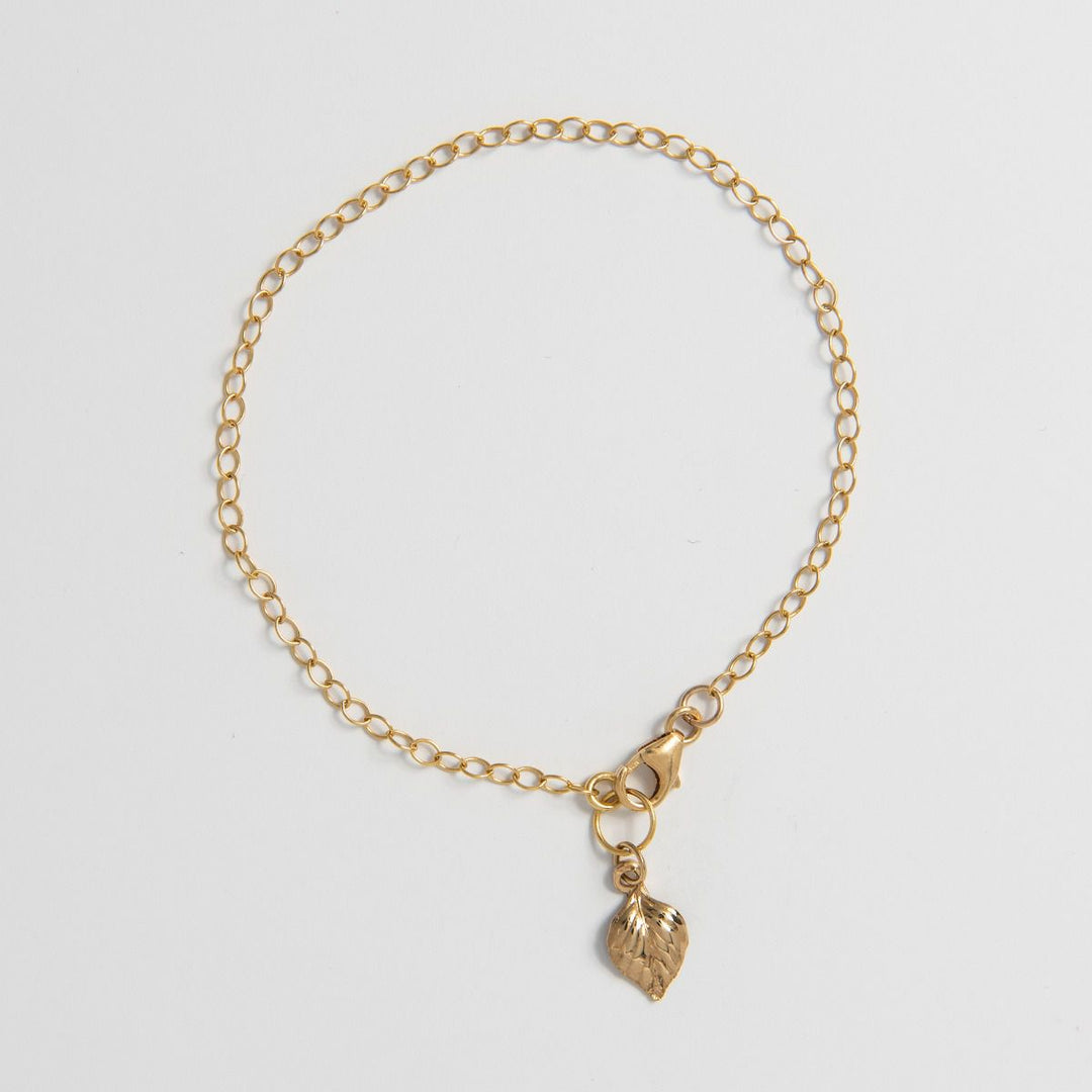 Blackbird Jewellery Birch leaf gold vermeil charm bracelet on white background – handmade nature inspired jewellery gift