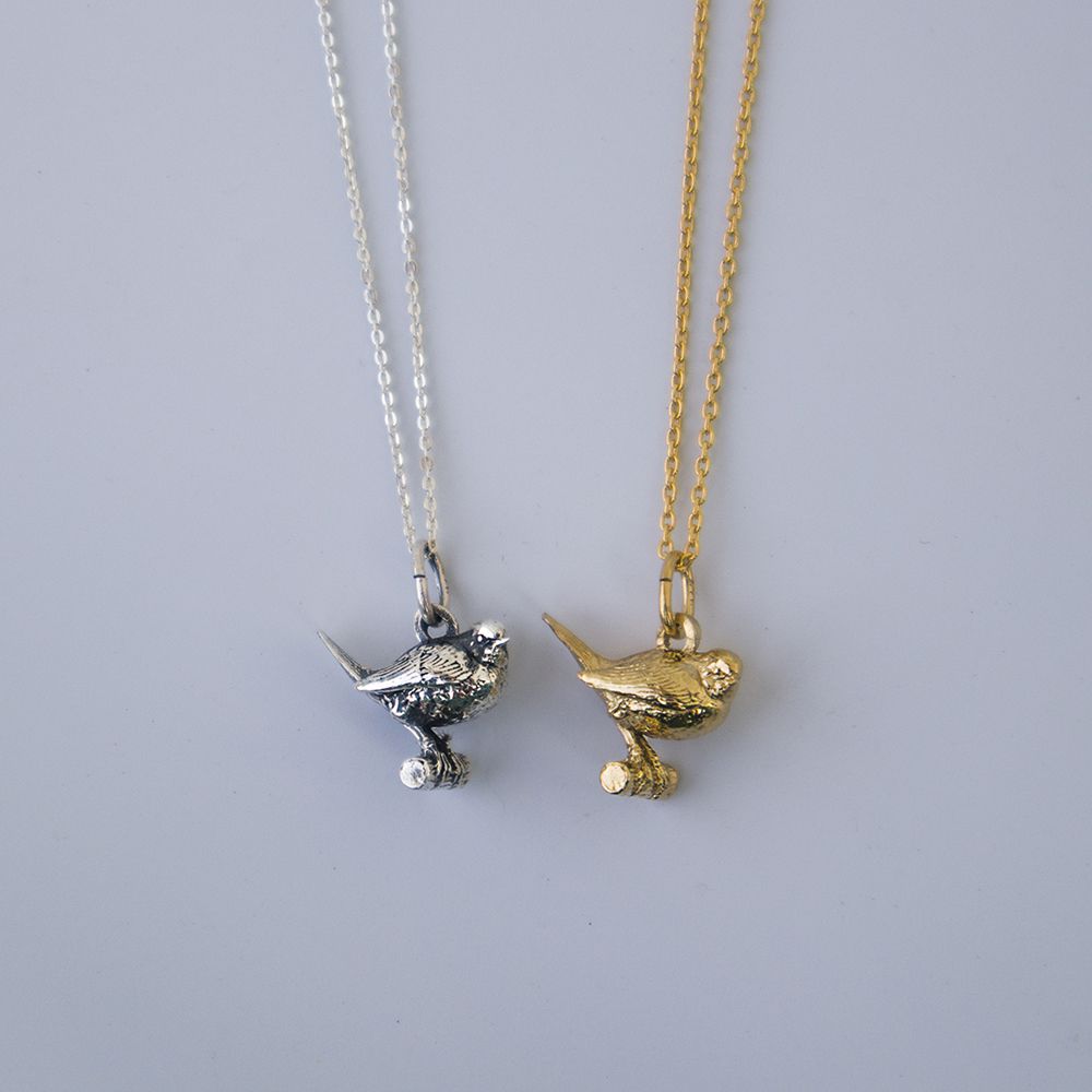 Blackbird Jewellery Close-up of gold vermeil robin charm necklace– meaningful nature-inspired charm gift