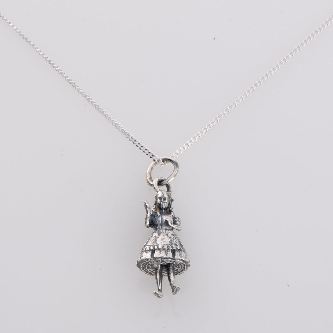 Blackbird Jewellery sterling silver Alice in Wonderland necklace featuring Alice holding the Drink Me bottle on a fine silver chain