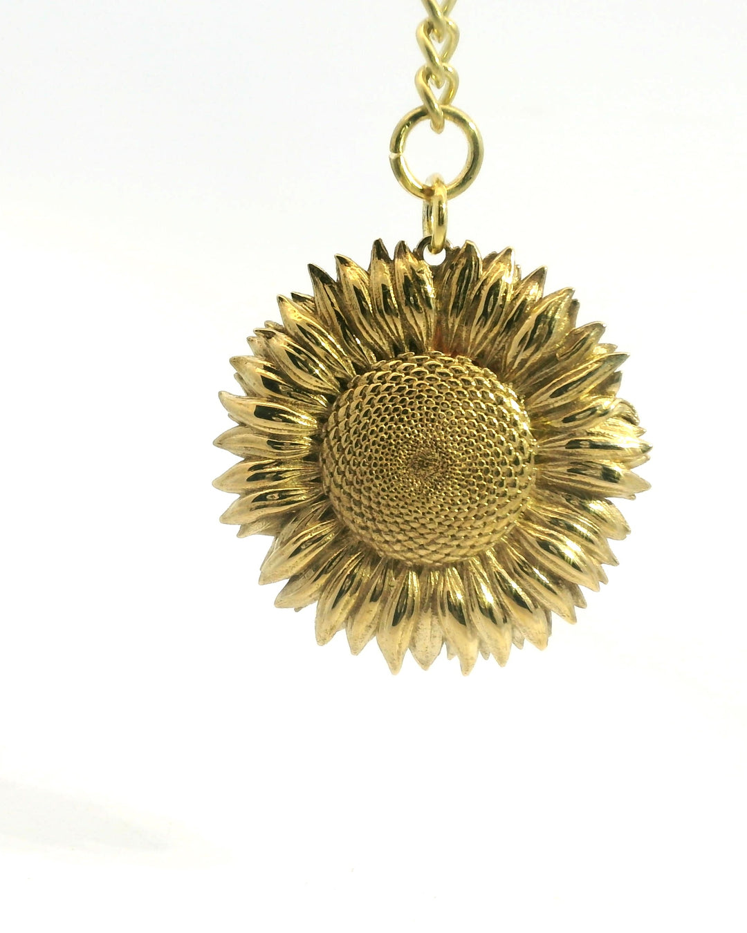 Close-up of Blackbird Jewellery's Sunflower Bag Charm, handmade in the UK from solid brass.