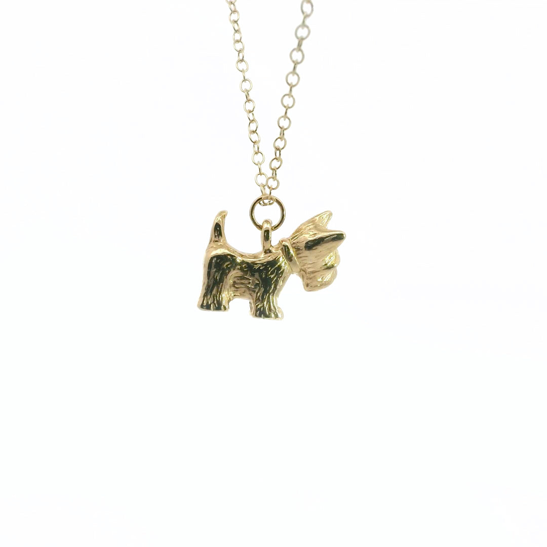 Close-up of Scottie Dog pendant in 18ct gold vermeil on an adjustable chain.