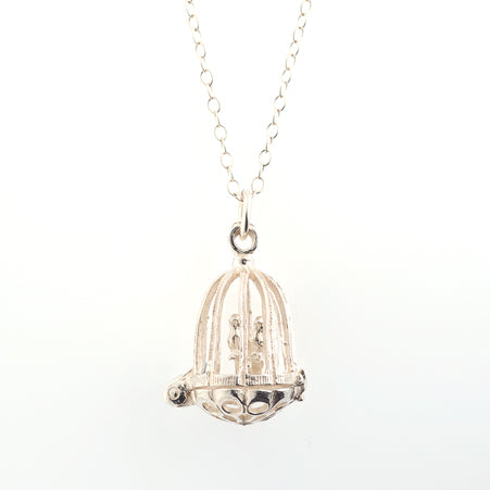 Sterling Silver Birdcage Necklace with a tiny bird inside, handcrafted in the UK by Blackbird Jewellery