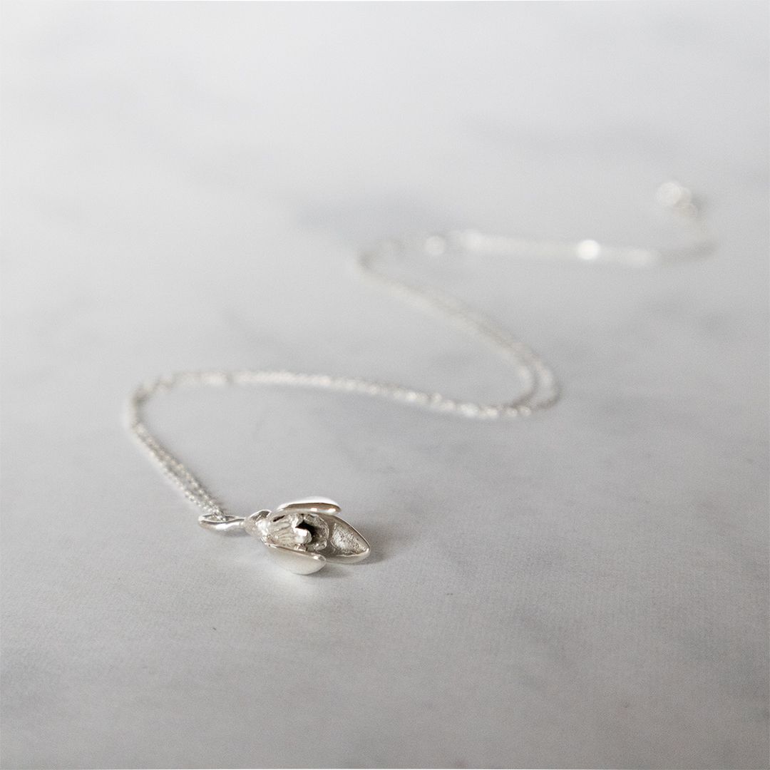 Nature-inspired snowdrop necklace symbolising hope and renewal.