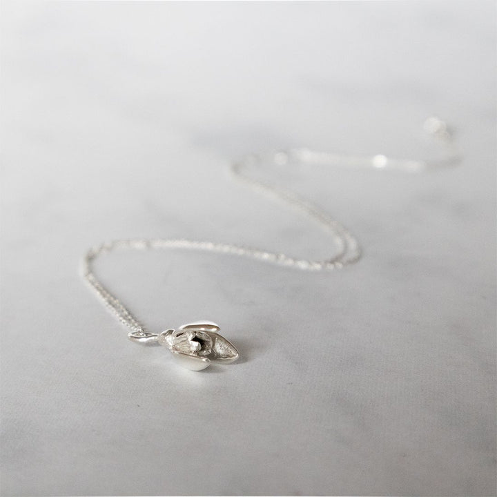 Nature-inspired snowdrop necklace symbolising hope and renewal.