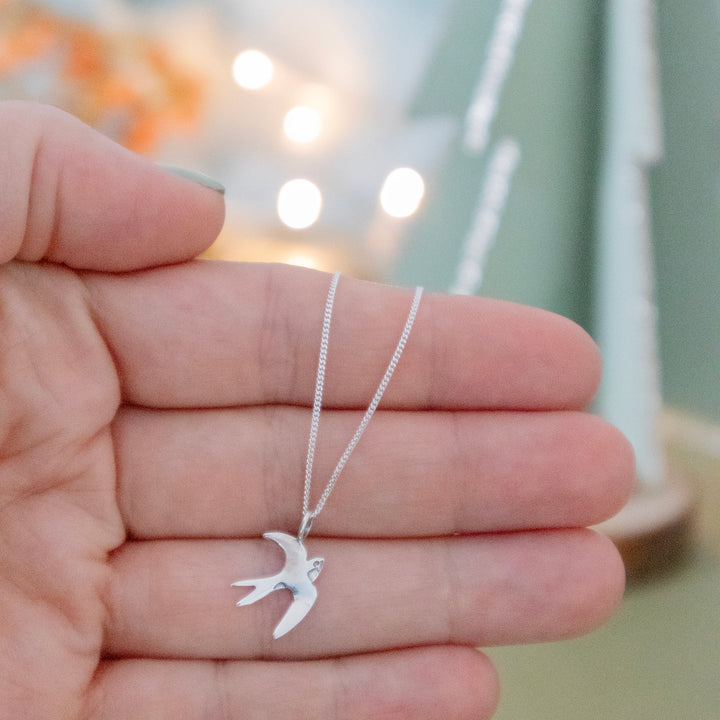 Sterling Silver Swallow Bracelet with a delicate bird charm, handcrafted for nature lovers.