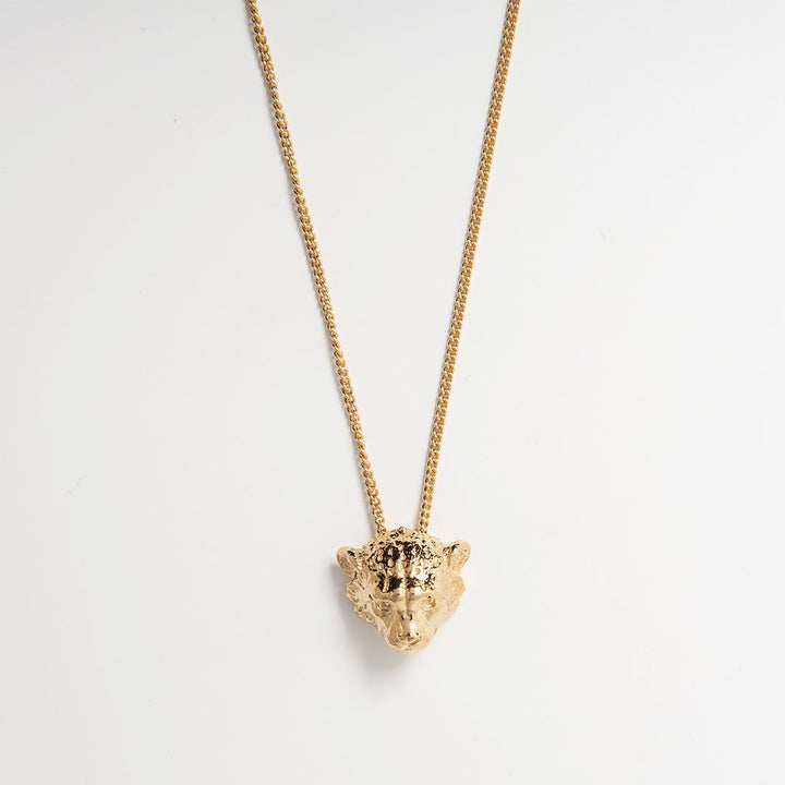 Blackbird Jewellery 18ct gold vermeil cheetah cub necklace on an 18 inch curb chain, handmade in the UK and supporting cheetah conservation