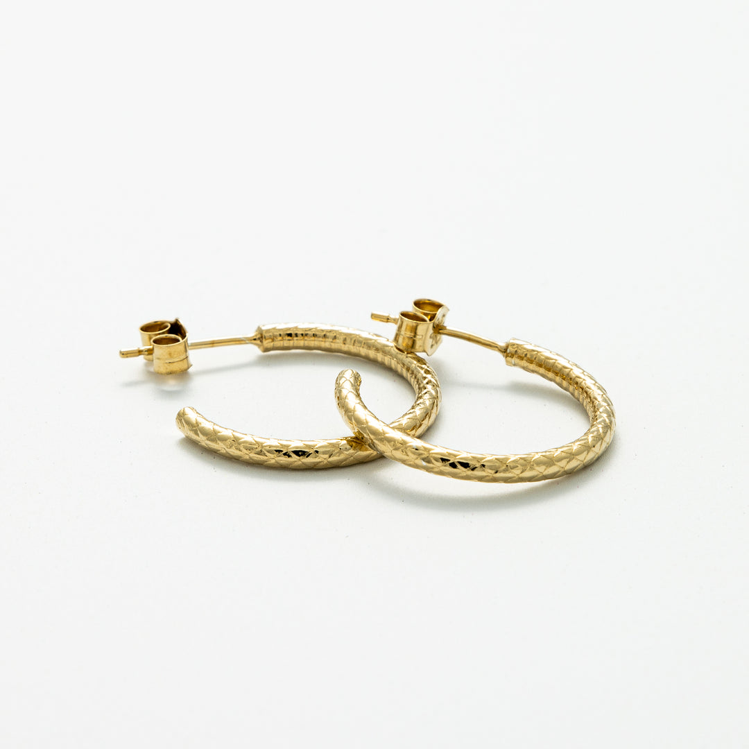 Blackbird Jewellery Handmade 18ct Gold Vermeil Snakeskin Hoop Earrings featuring a detailed snakeskin texture and a stem with push-back closure.
