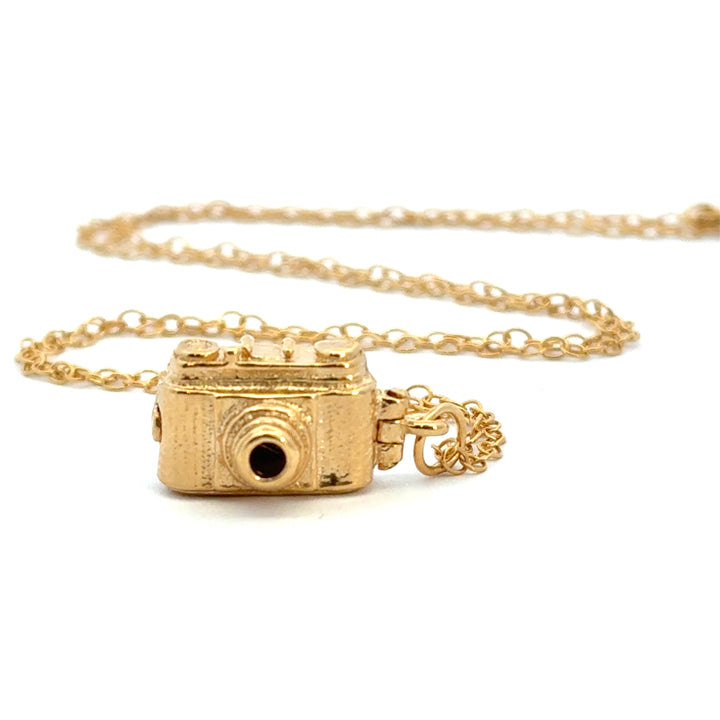 Blackbird Jewellery 18ct gold vermeil vintage camera necklace on a chain, handcrafted from recycled silver with oxidised detail on a white background