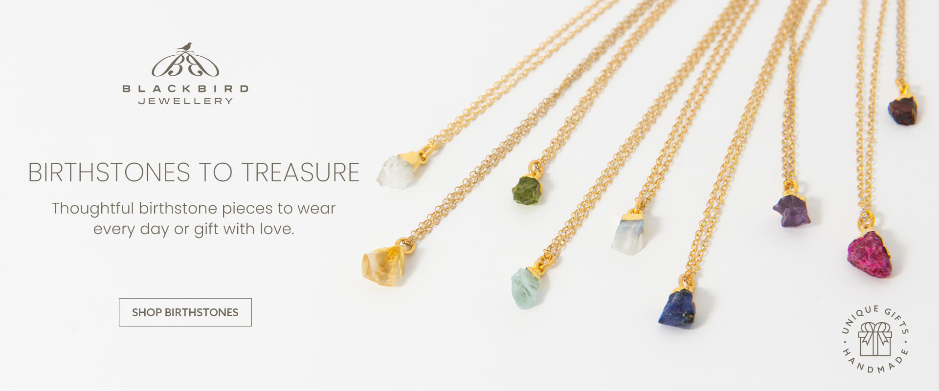 Blackbird Jewellery birthstones banner featuring gold birthstone necklaces and crystal pendants