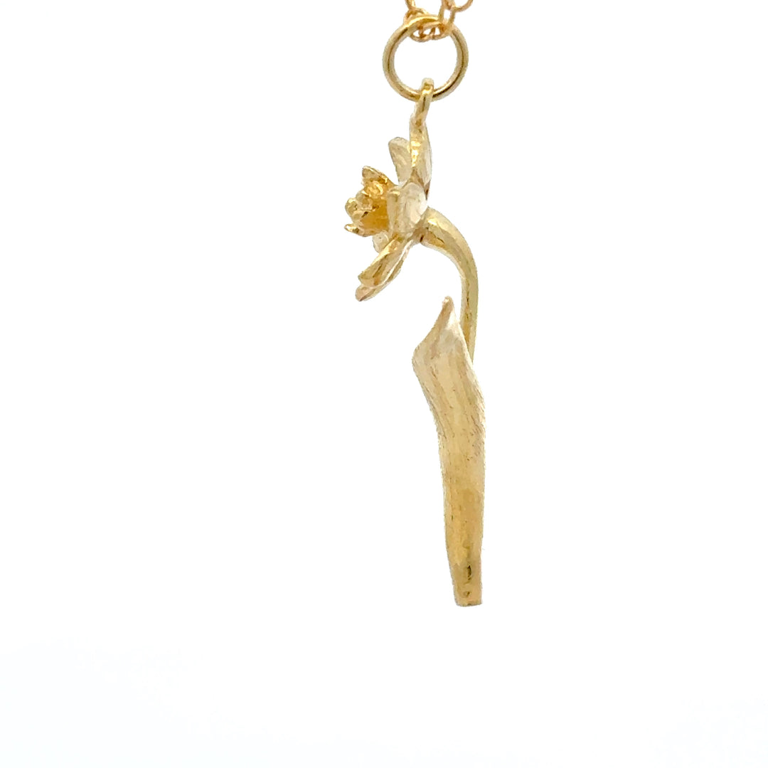 Blackbird Jewellery gold vermeil daffodil flower necklace with curved stem detail.
