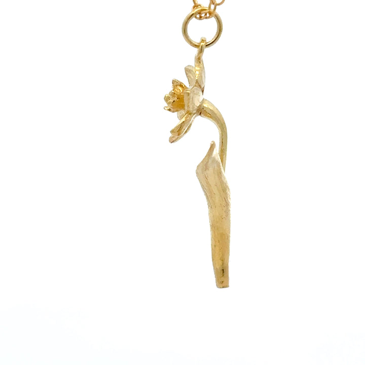 Blackbird Jewellery gold vermeil daffodil flower necklace with curved stem detail.