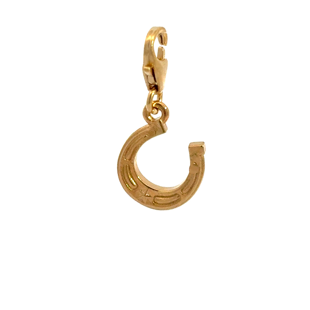 Blackbird Jewellery Gold horseshoe charm on a white background