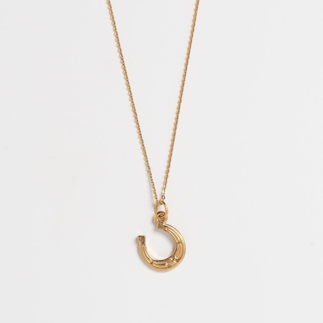 18ct gold vermeil lucky horseshoe charm necklace on fine chain handcrafted good luck jewellery by Blackbird Jewellery