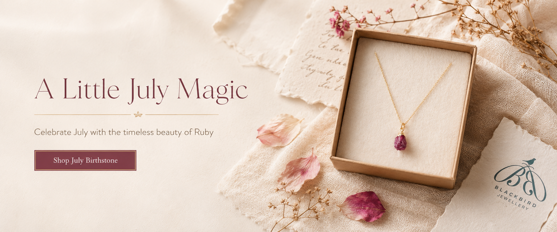 Raw ruby gemstone necklace in gold vermeil presented in a Blackbird Jewellery gift box with soft fabric and dried petals for the July birthstone edit.