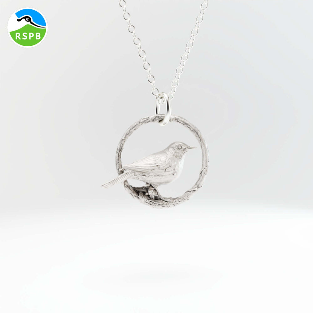 Blackbird Jewellery sterling silver necklace featuring a blackbird perched on a branch, presented on a white background with a RSPB logo