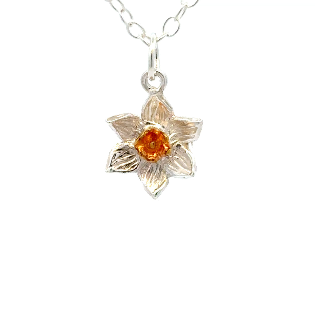 Blackbird Jewellery Sterling silver daffodil bloom necklace close up with gold centre inspired by the March birth flower and national flower of Wales.