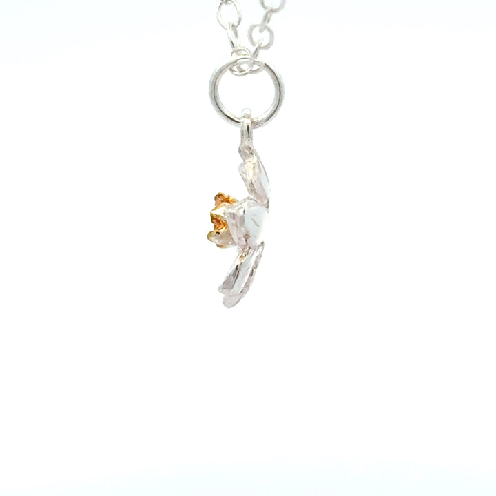 Blackbird Jewellery Sterling silver daffodil bloom necklace side view detail with gold centre inspired by the March birth flower and national flower of Wales.