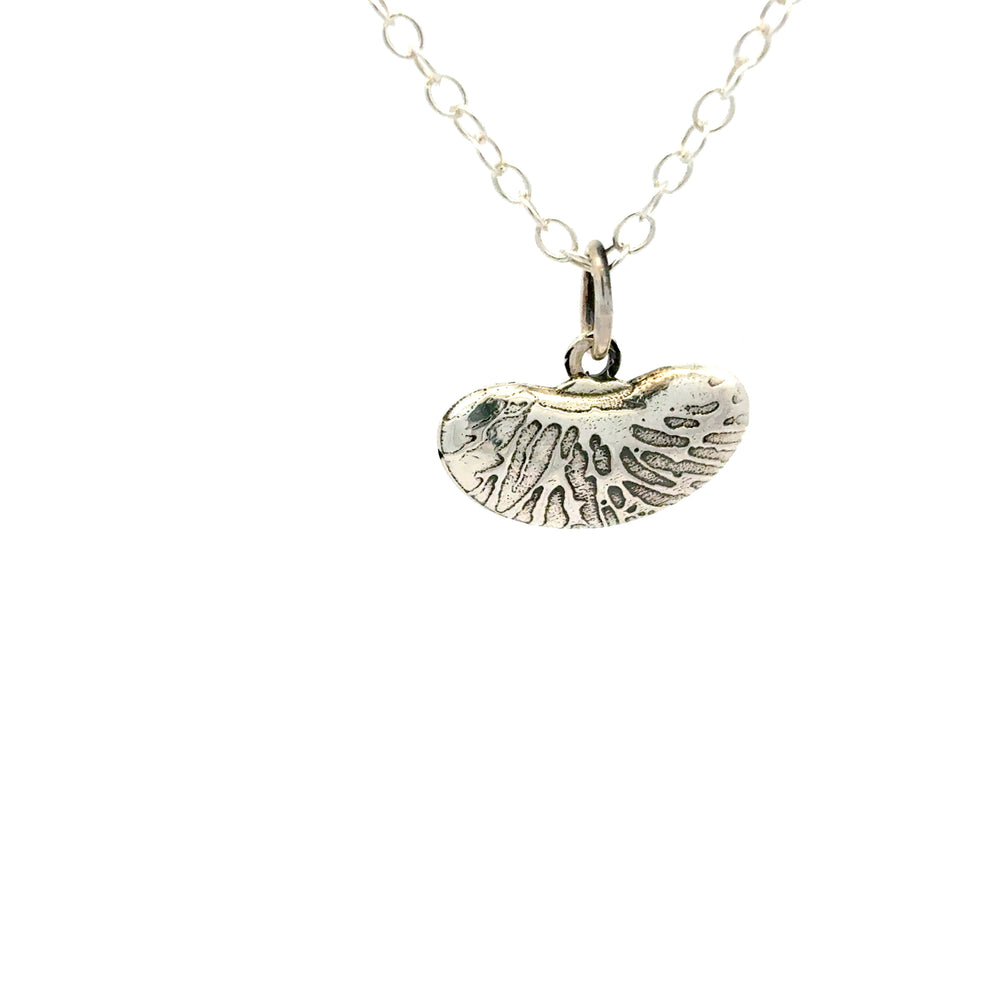 Blackbird Jewellery Sterling silver kidney bean necklace with textured organic pendant on a white background