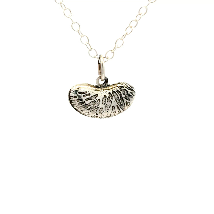 Blackbird Jewellery Sterling silver kidney bean necklace with textured organic pendant on a white background