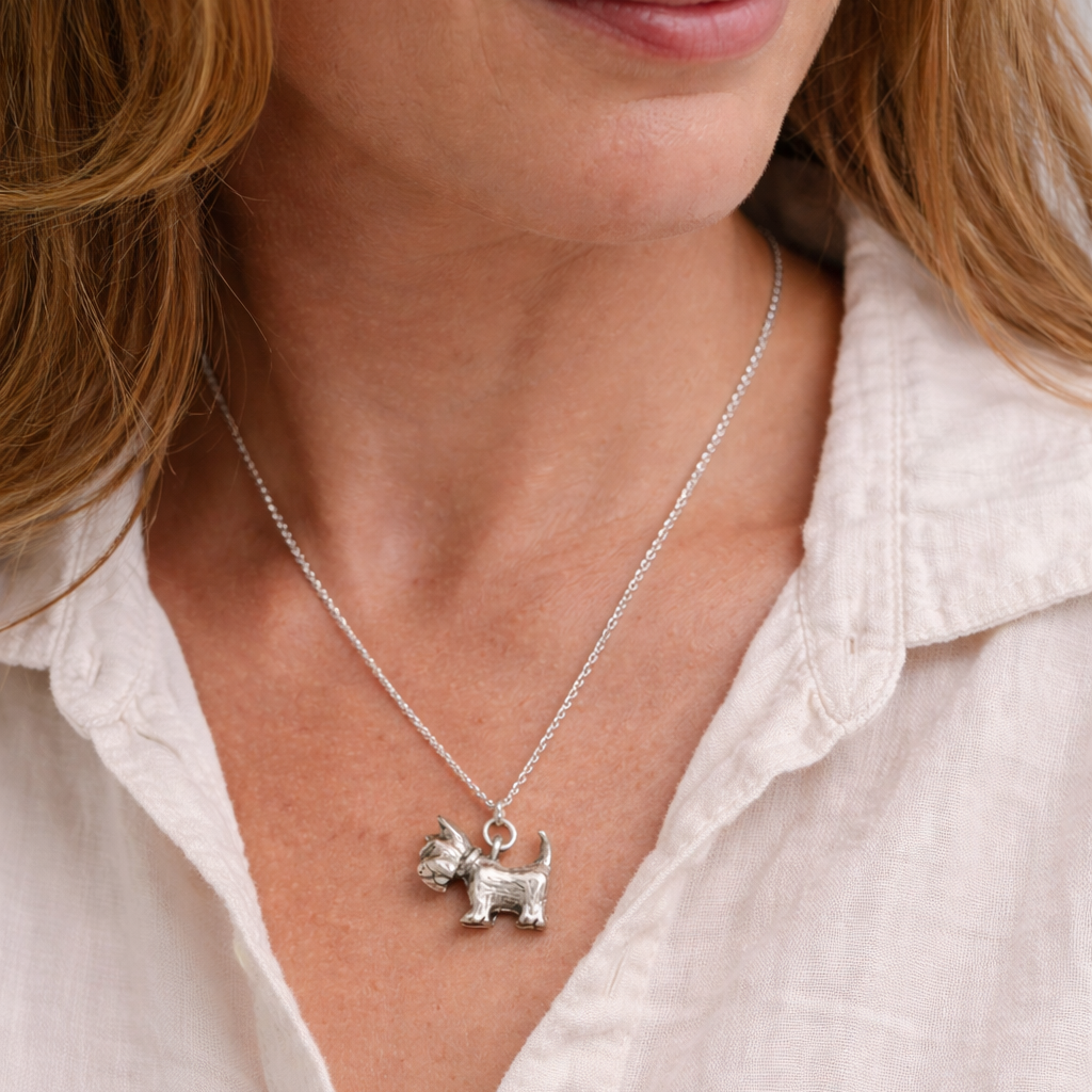 Blackbird Jewellery sterling silver Scottish Terrier necklace worn by a woman, handmade dog jewellery gift