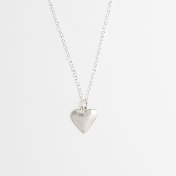 Blackbird Jewellery sterling silver small heart necklace on fine chain, handmade in the UK on a white background