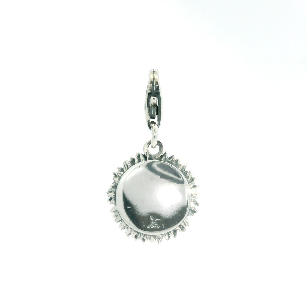 Showing the back of the handmade blackbird jewellery sterling silver sunflower charm next to sunflower necklace – gift for all occasions