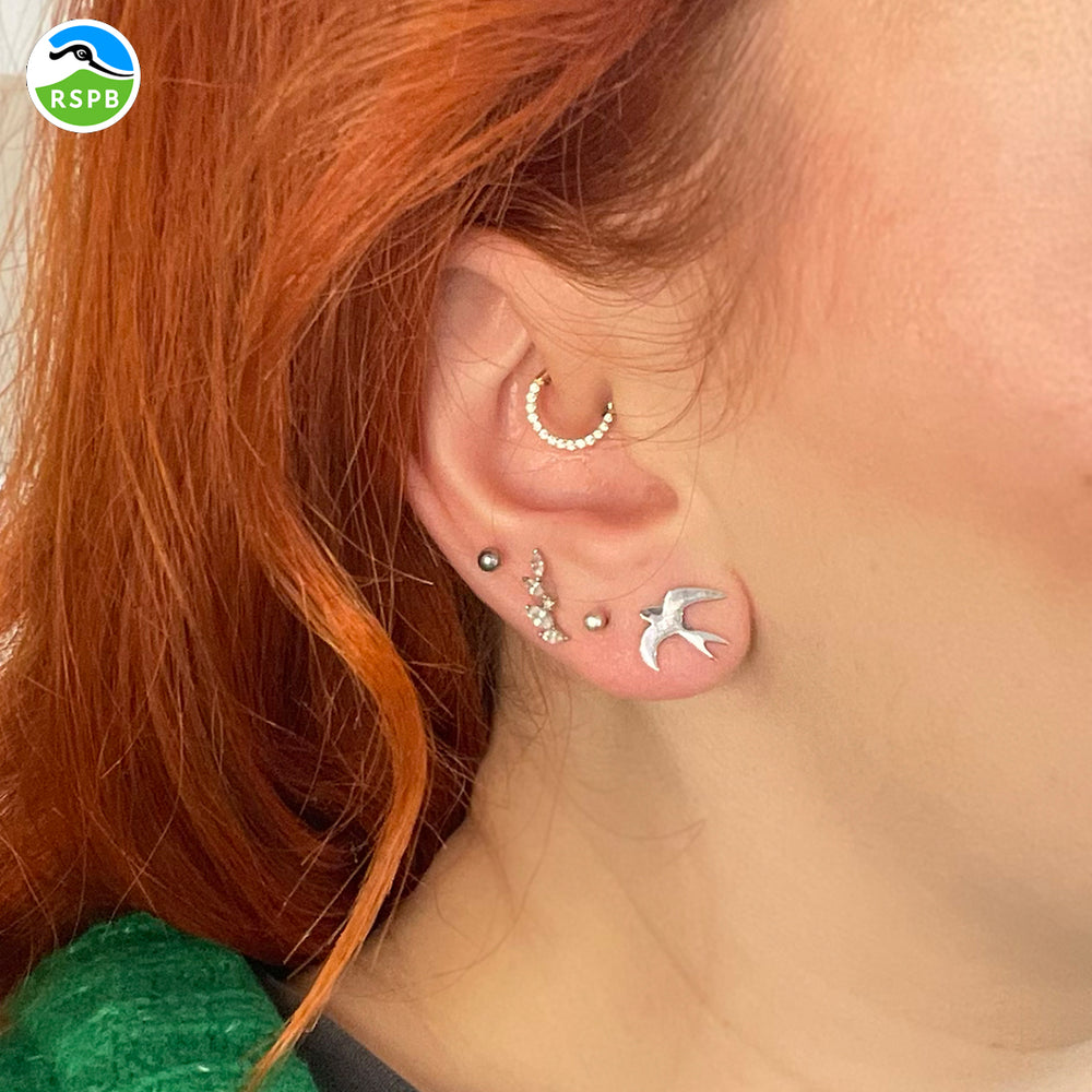 Blackbird Jewellery Side view of handmade sterling silver swallow earrings – meaningful jewellery gift for nature lovers.