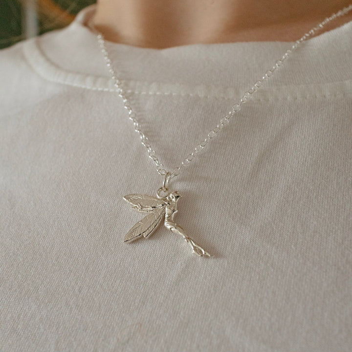blackbird-jewellery-sterling-silver-tinker-bell-necklace-model-wearing on a white t-shirt