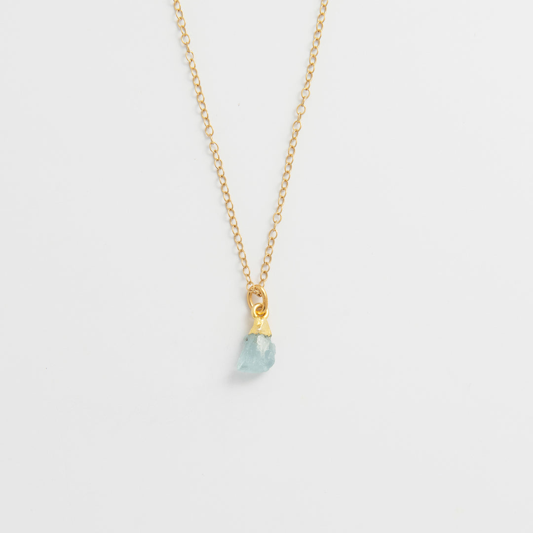 Blackbird Jewellery Gold vermeil raw aquamarine crystal necklace with delicate fine chain on white background