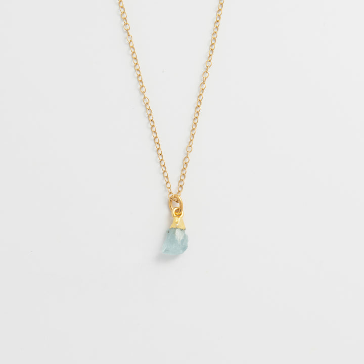 Blackbird Jewellery Gold vermeil raw aquamarine crystal necklace with delicate fine chain on white background
