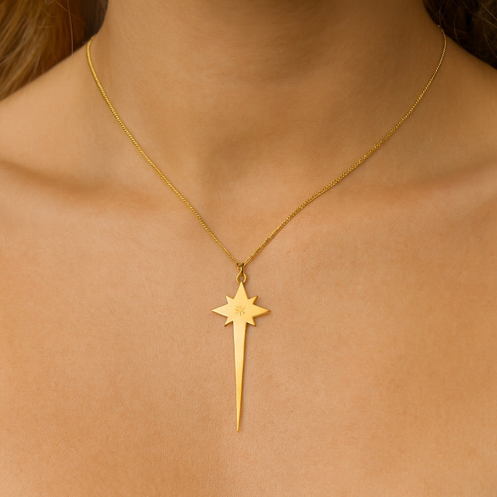 Close-up of 18ct gold vermeil North Star pendant with etched central star